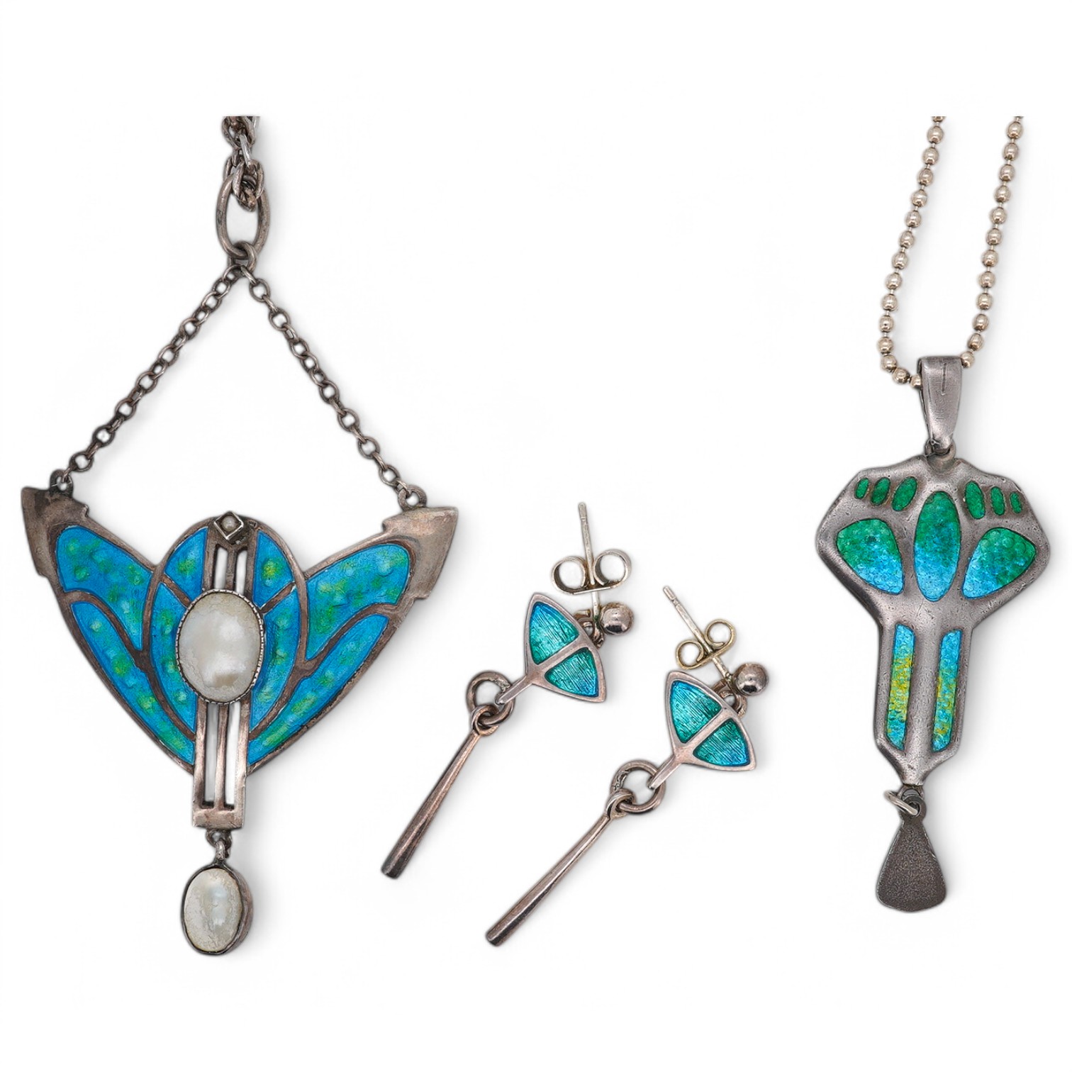 An Edwardian Art Nouveau silver and enamel drop pendant, by Charles Horner, Chester, 1908, 46mm, on a later 925 chain, together with one other Art Nouveau white metal, enamelled and mother of pearl set pendant necklace a